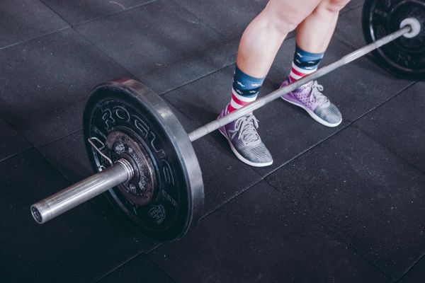 Guide complet sur le poids idéal d'une barre olympique
